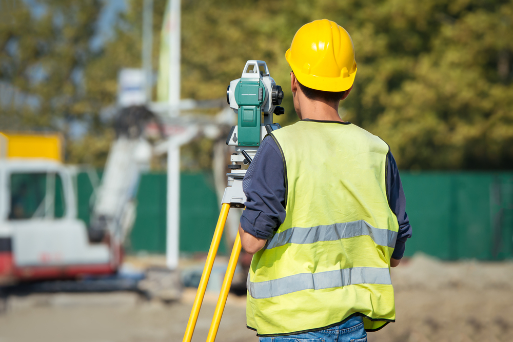 اعمال رفع مساحي surveyor,engineers,working,with,theodolite,on,road,construction,site